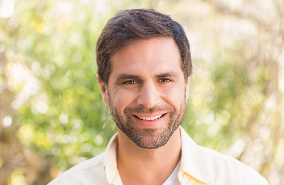 Young man smiling at camera